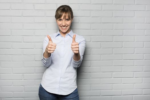 Female casual cheerful studio  gesture grey background