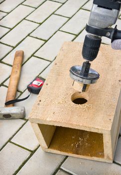 Making a birdhouse from wooden boards spring season