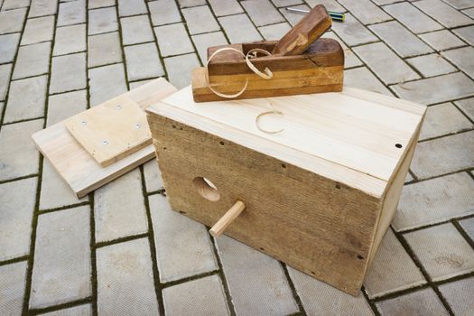 Making a birdhouse from wooden boards spring season