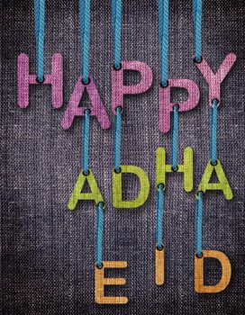 Happy Adha Eid Letters hanging strings with blue sackcloth background.