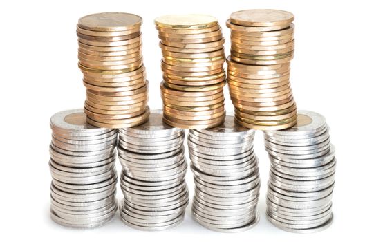 Stacks of Canadian coins on white background