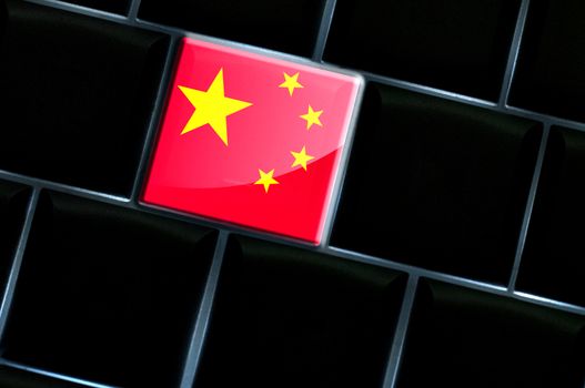 Chinese online concept with flag over the backlit keyboard