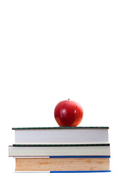 Red apple on stack old and newer books