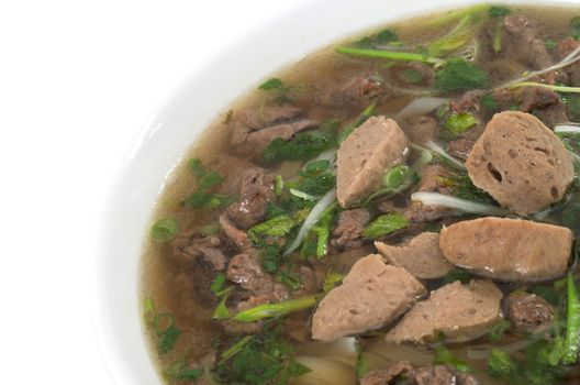 Vietnamese food , rice noodle soup with sliced sauteed beef and meat ball 