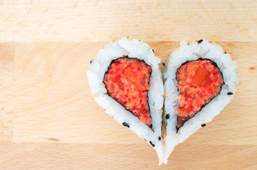 Two pieces of sushi forming the heart shape