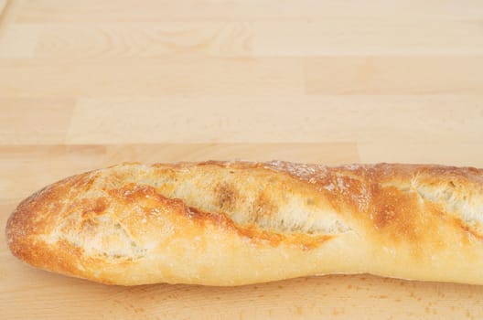 French Bread Baguette on wooden cutting board