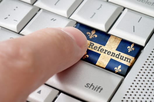 Quebec online voting referendum concept on metallic keyboard
