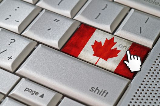 Business concept mouse cursor pressing Canada enter key on metallic keyboard