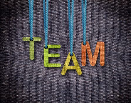 Team Letters hanging strings with blue sackcloth background.
