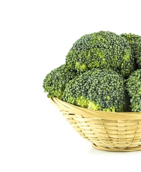 Fresh broccoli in Straw basket on white background.