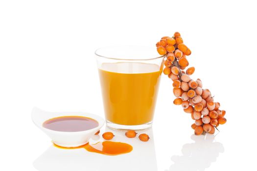 Sea buckthorn juice, oil and berries isolated on white background. Natural detox.