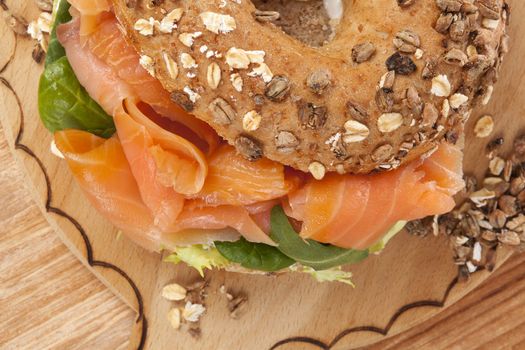 Delicious bagel eating. Fresh baked bagel with smoked salmon top view. American eating. 