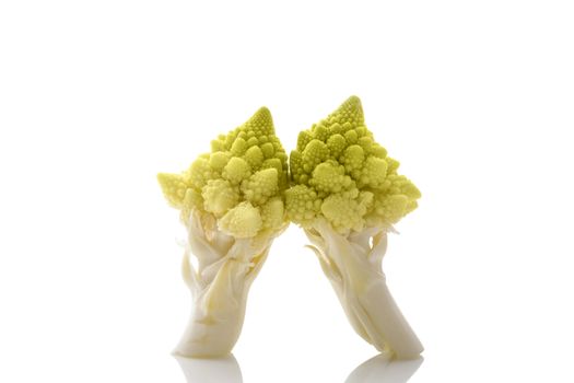 Romanesque cauliflower pieces isolated on white background with reflection. Healthy raw food diet.