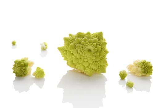 Romanesco broccoli pieces isolated on white background. Culinary healthy fresh vegetable eating.