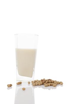 Glass of organic soya milk with soya beans  isolated on white background. Healthy vegan eating.