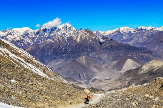 Mountain biker in Himalayas mountains landscape, Nepal