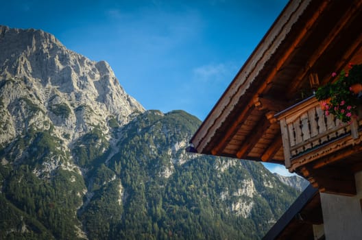 Rustic Photograph Of A Traditional Alpine Chalet In The Summer