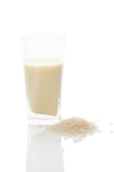 Rice milk in glass isolated on white background. Vegan and vegetarian milk concept.