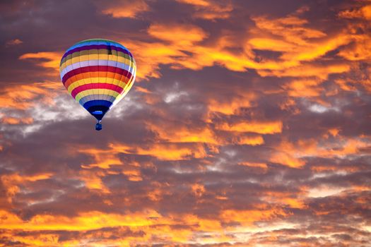 Balloon on Sunset / sunrise with clouds, light rays and other atmospheric effect