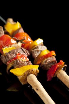 Barbeque sticks with meat, vegetables and corn