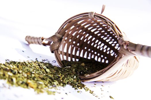 Bamboo tea strainer whith green tea studio shot 