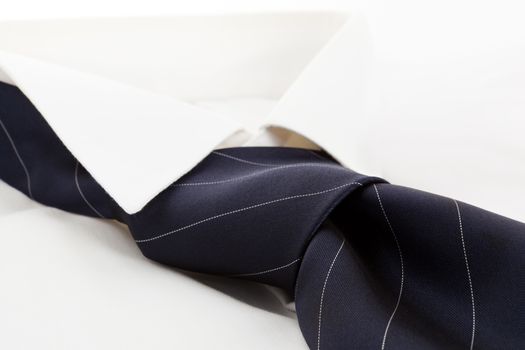 White dress shirt with blue tie. Modern simple business concept.