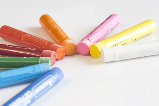 Crayons concept on white isolated background