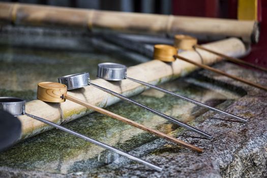 water dipper on front of shrine