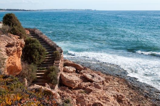 Stone staircase by the Mediterranean sea.