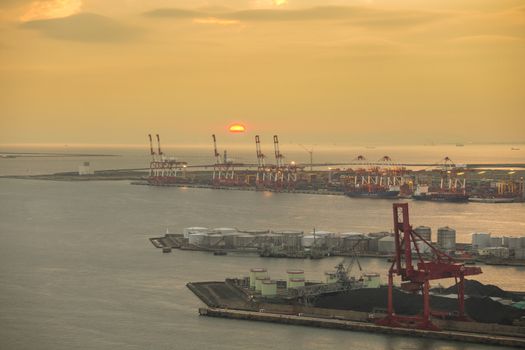 Container stacks and crane in shipyard at sunset for cargo Goods and Logistic background