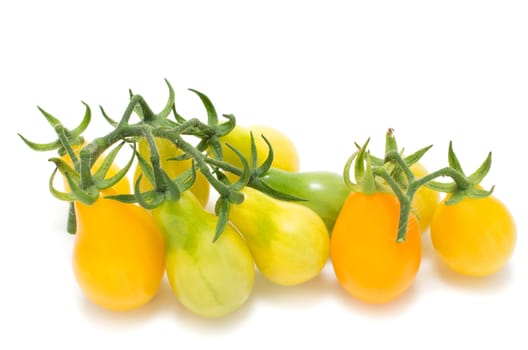 Yellow cherry tomatoes isolated on white background
