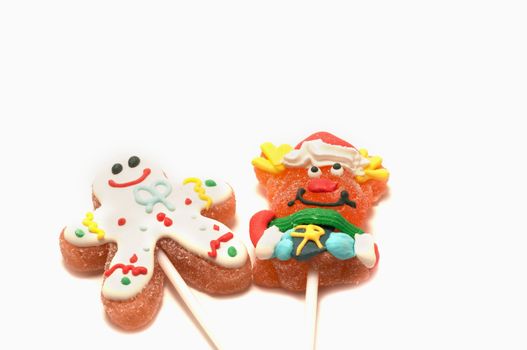 Two Chistmas lollipops on white background