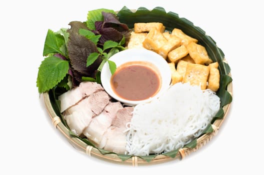 Vietnamese traditional plate pork vermicelli  tofu and vegetable in bamboo plate