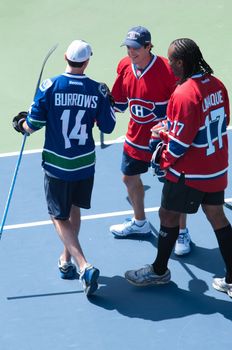 MONTREAL CANADA AUGUST 03 2013: Daniel "Danny" Briere is a Canadian professional ice hockey player who plays for the Montreal Canadiens of the National Hockey League. Briere, Larraque and Burrows was playing a friendly outdoor hockey match at Canadian Tennis Open Rogers Cup in Montreal.