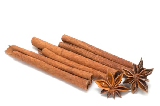 Cinnamon sticks, star anise on white background