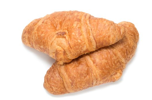 Two French croissants on white background