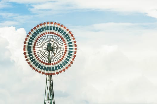 Wind turbine is a circle and the sky.
Thailand