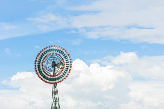 Wind turbine is a circle and the sky.
Thailand