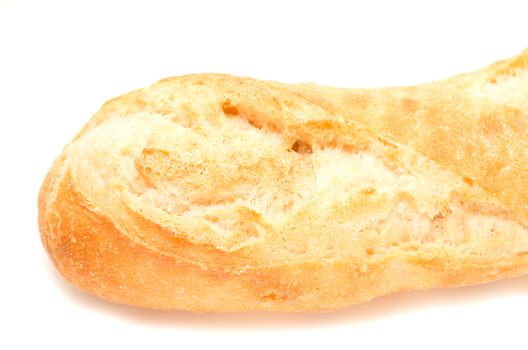 Left end of a french baguette on white background