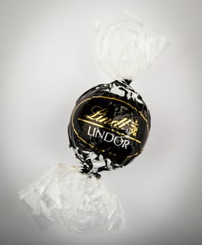 AYTOS, BULGARIA - APRIL 02, 2014: Milk Chocolate LINDOR truffle. Lindt & Spr��ngli is recognized as a leader in the market for premium quality chocolate.