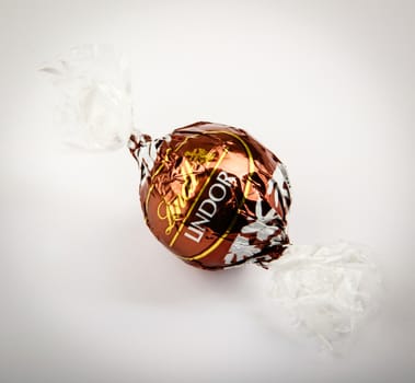 AYTOS, BULGARIA - APRIL 02, 2014: Milk Chocolate LINDOR truffle. Lindt & Spr��ngli is recognized as a leader in the market for premium quality chocolate.