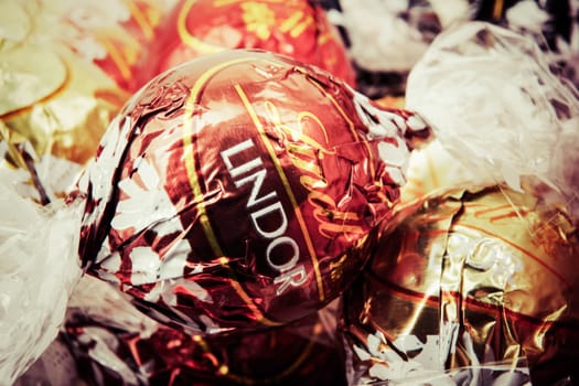 AYTOS, BULGARIA - APRIL 02, 2014: Milk Chocolate LINDOR truffle. Lindt & Spr��ngli is recognized as a leader in the market for premium quality chocolate.