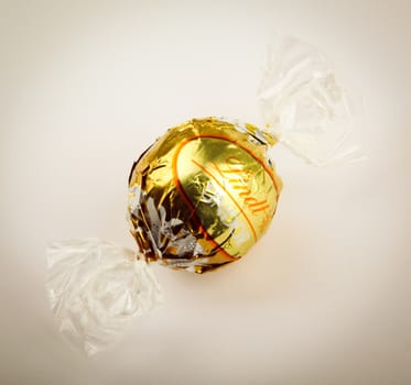 AYTOS, BULGARIA - APRIL 02, 2014: Milk Chocolate LINDOR truffle. Lindt & Spr��ngli is recognized as a leader in the market for premium quality chocolate.