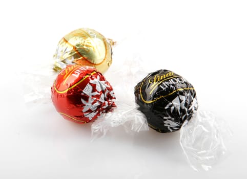 AYTOS, BULGARIA - APRIL 02, 2014: Milk Chocolate LINDOR truffle. Lindt & Spr��ngli is recognized as a leader in the market for premium quality chocolate.