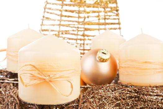 Beautiful traditional christmas still life with candles, balls and golden tree in background. Traditional golden xmas concept.