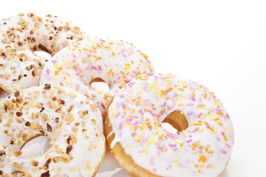 Delicious donuts on white background with copy space. Sweet breakfast concept.