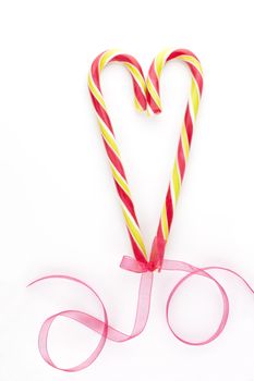 Traditional american candy cane christmas love background with copy space. Xmas candy still life.