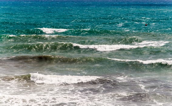 Waves breaking from blue to green, Mediterranean coast, Costa Blanca, Spain.