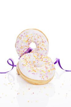 Delicious colorful donuts isolated on white background decorated with garnish. Luxurious sweet desert concept. Good morning.