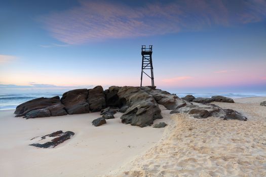 Redhead Beach, a coastal suburb of Lake Macquarie, NSW, Australia  with shark tower just before sunrise, pretty pastels